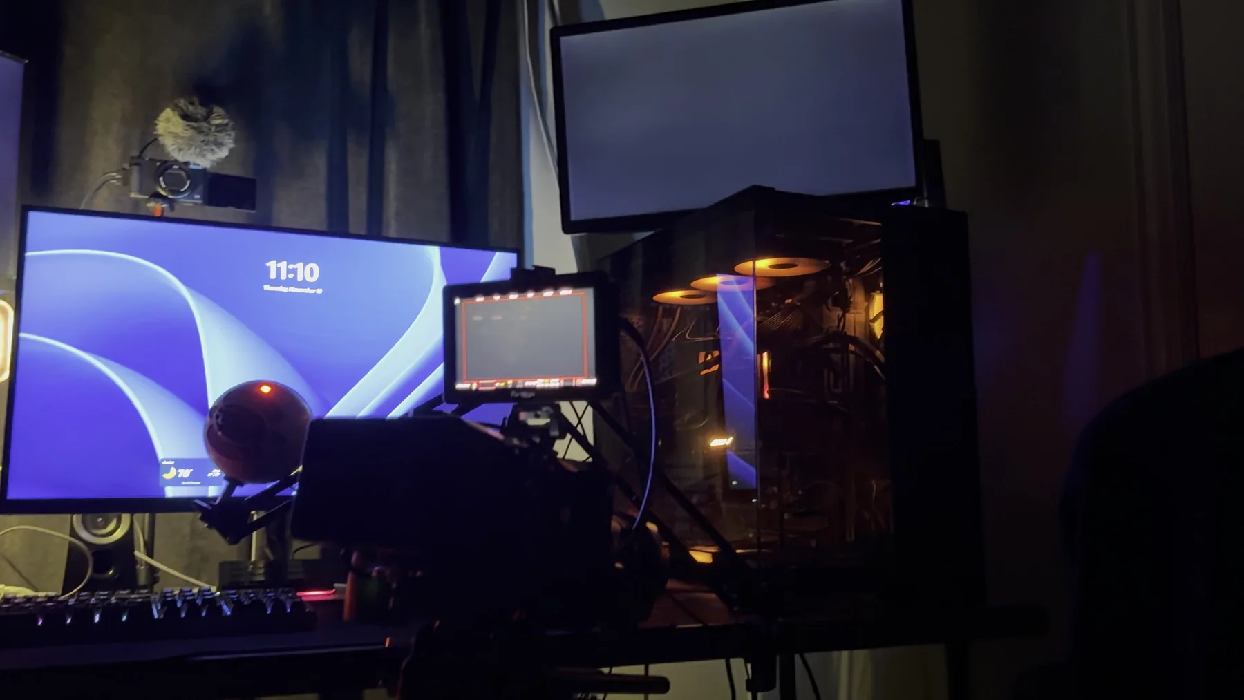 Creator workstation with camera, monitors, and a desktop PC