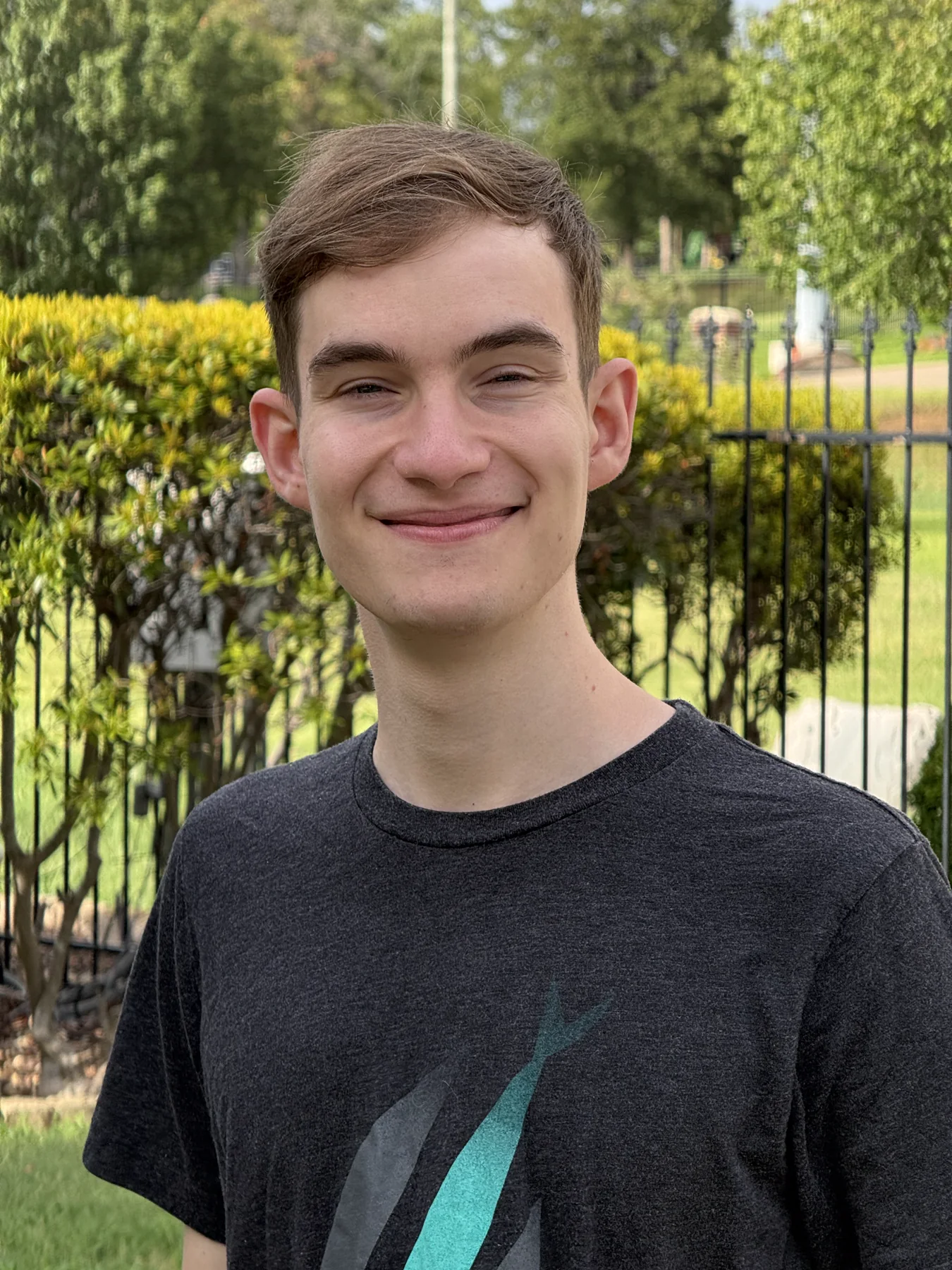 Zachary Debenport smiling outdoors