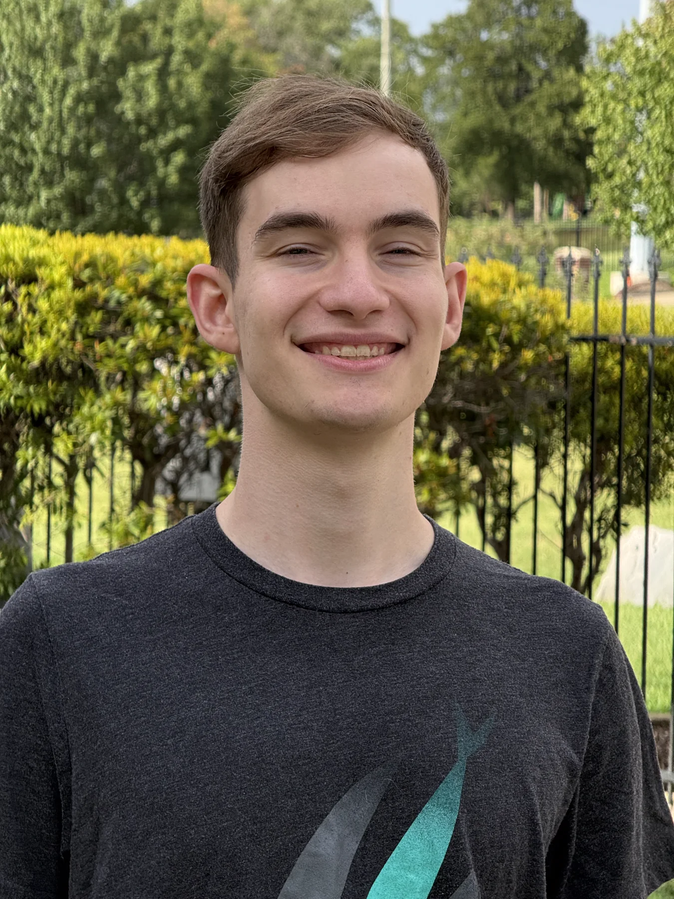 Zachary Debenport smiling outdoors